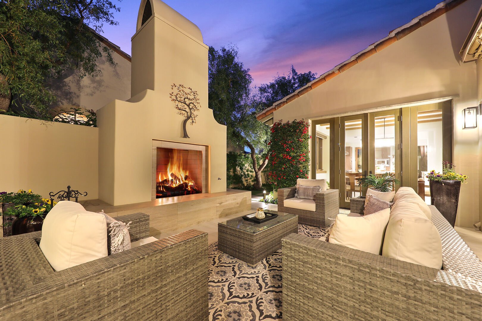The outdoor fireplace in one of our Palm Desert vacation homes